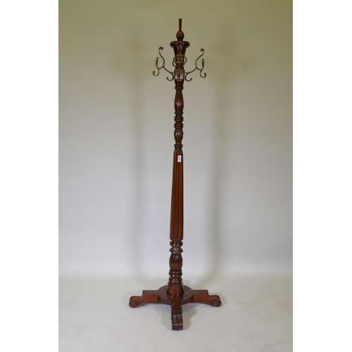 1059 - A Harrods Victorian style mahogany coat stand, with revolving brass hooks, 175cm high