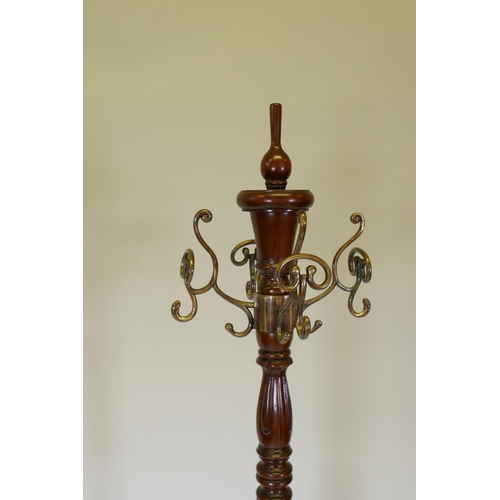 1059 - A Harrods Victorian style mahogany coat stand, with revolving brass hooks, 175cm high