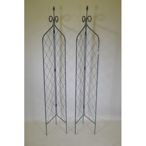 1060 - A pair of wrought iron folding two sided garden trellises, 215cm high