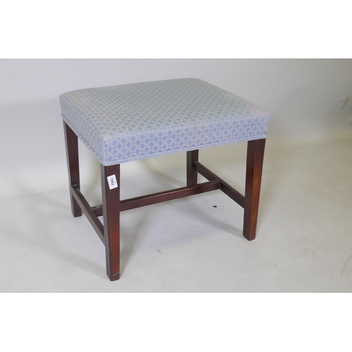 1062 - A C19th mahogany stool, raised on square tapering supports united by an H stretcher, 51 x 44 x 46cm