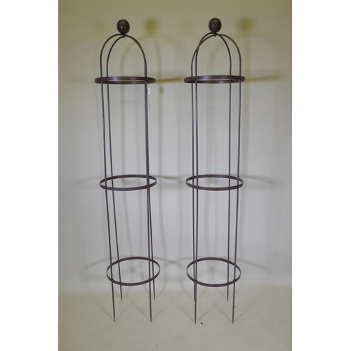 1064 - Two wrought iron plant obelisks, 192cm high