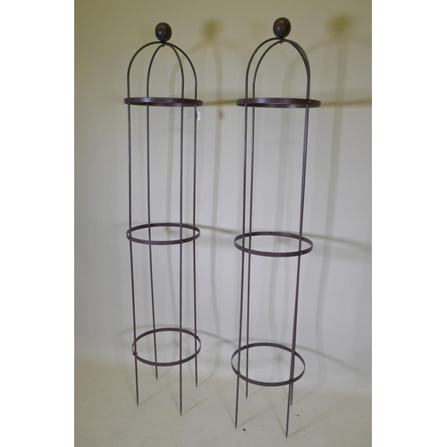 1064 - Two wrought iron plant obelisks, 192cm high