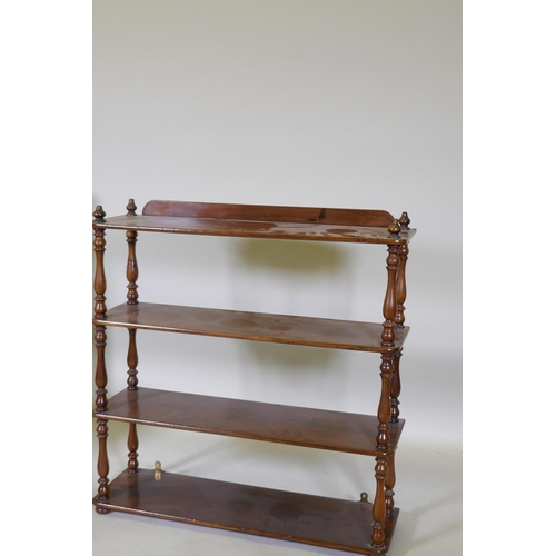 1065 - A C19th mahogany four tier open hanging shelf, with turned baluster shaped supports, 69 x 20 x 71cm,... 