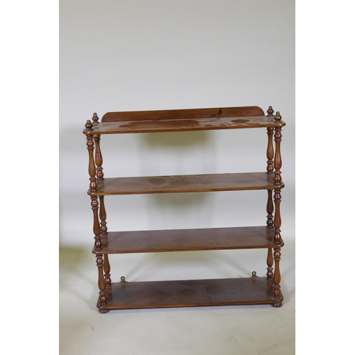 1065 - A C19th mahogany four tier open hanging shelf, with turned baluster shaped supports, 69 x 20 x 71cm,... 