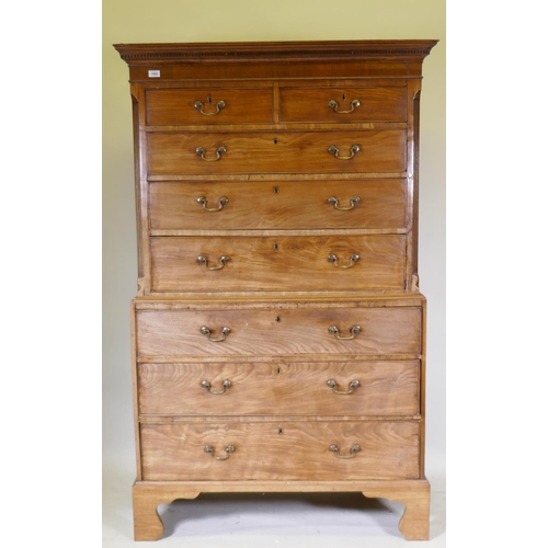 1069 - A Georgian mahogany chest on chest, the upper section with dentil cornice and canted and reeded corn... 