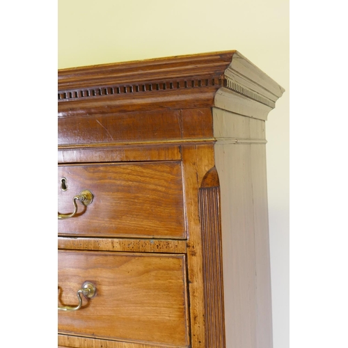 1069 - A Georgian mahogany chest on chest, the upper section with dentil cornice and canted and reeded corn... 