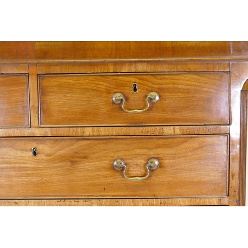 1069 - A Georgian mahogany chest on chest, the upper section with dentil cornice and canted and reeded corn... 