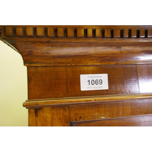 1069 - A Georgian mahogany chest on chest, the upper section with dentil cornice and canted and reeded corn... 