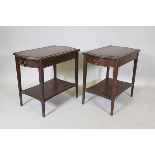 1073 - A pair of mahogany end tables with a single drawer, leather inset tops, tapered legs and an under ti... 