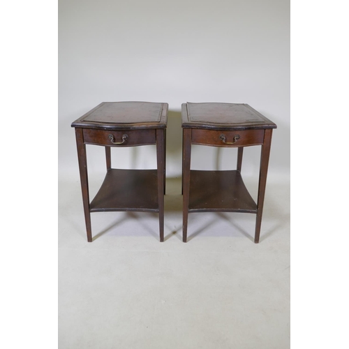 1073 - A pair of mahogany end tables with a single drawer, leather inset tops, tapered legs and an under ti... 