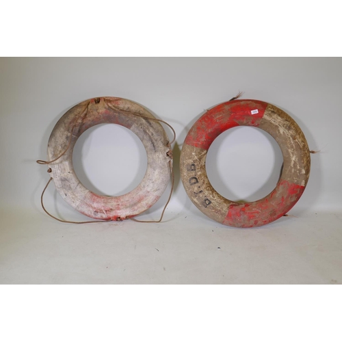 1079 - A pair of vintage life buoys, 80cm diameter