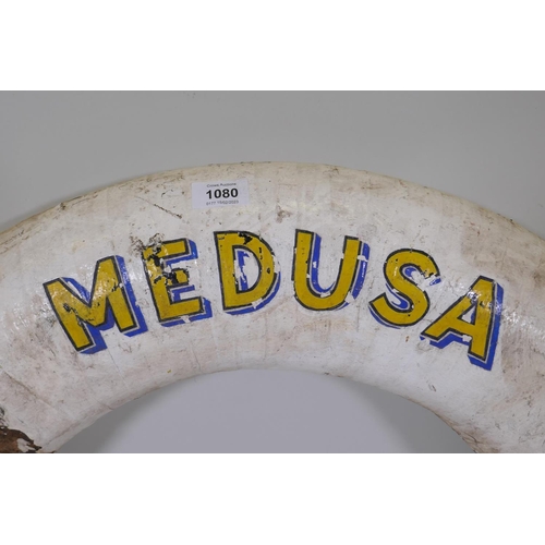 1080 - An antique cork and canvas lifebuoy, the Medusa, Weymouth, 74cm diameter