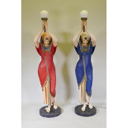 1082 - A pair of life size composition torchere lamps in the form of Egyptian maidens, 184cm high