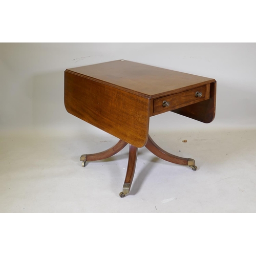 1084 - A George III mahogany pembroke table with single end drawer, raised on a turned column and splay sup... 