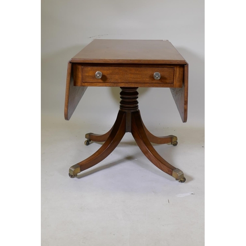 1084 - A George III mahogany pembroke table with single end drawer, raised on a turned column and splay sup... 