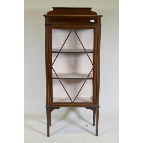 1087 - An Edwardian inlaid mahogany single door display cabinet, raised on tapering supports, 62 x 33 x 42c... 