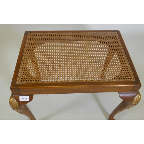 1093 - A Georgian style walnut stool with carved and parcel gilt decoration and cane seat, 56 x 41cm, 45cm ... 