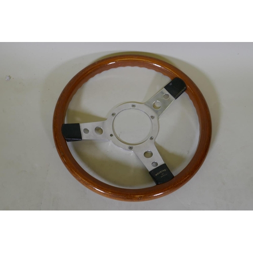 116 - A Mountney chrome and wood car steering wheel, 34cm diameter