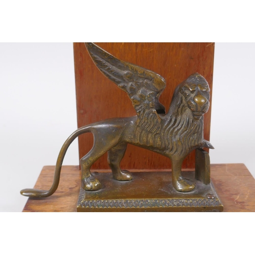 119 - A mahogany letter rack mounted with a bronze griffin, 14cm high