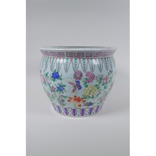 120 - A Chinese famille rose enamelled porcelain jardiniere, decorated with butterflies amongst flowers, s... 