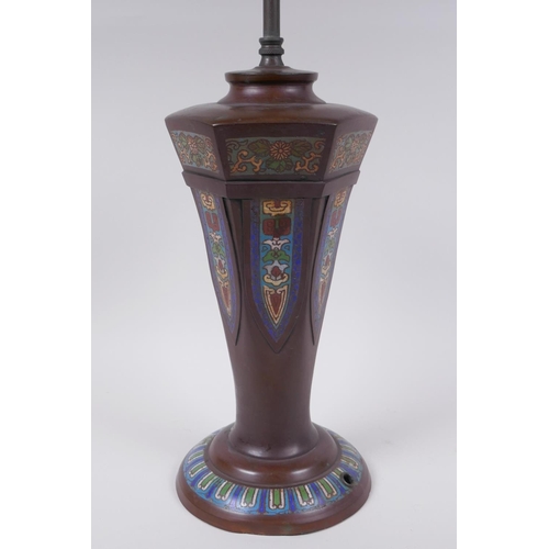 121 - A Chinese bronze lamp with decorative cloisonne panels, 58cm high