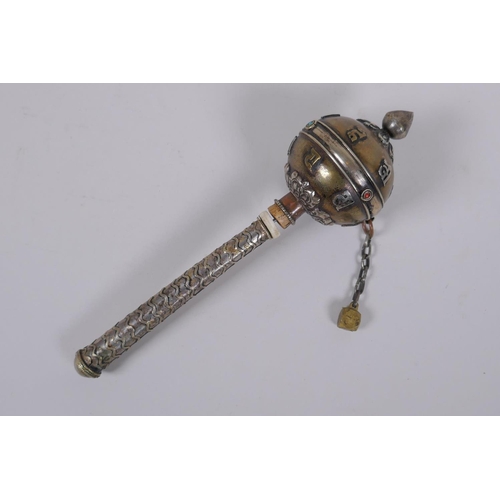 123 - A Tibetan bronze and silvered metal prayer wheel with raised script decoration, 22cm