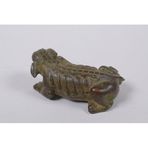 124 - A Japanese bronze okimono kylin signed, 7cm long