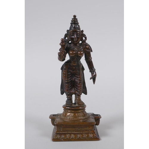 126 - An Indian bronze figure of a female deity, 12cm high