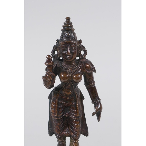 126 - An Indian bronze figure of a female deity, 12cm high