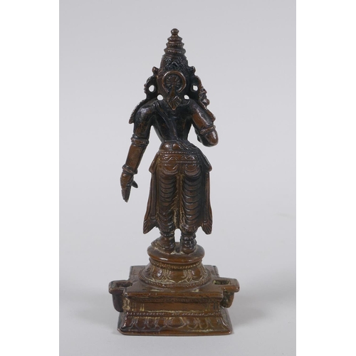 126 - An Indian bronze figure of a female deity, 12cm high