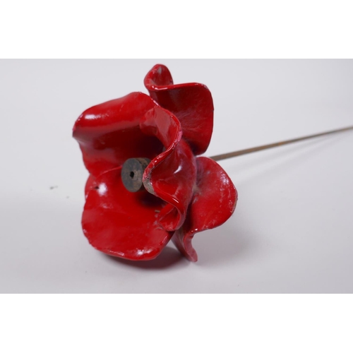 13 - Paul Cummins, (British, b. 1977), one of 888,246 ceramic poppies from the 2014 installation 'Blood S... 