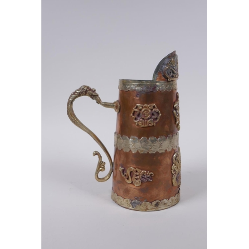 133 - A Chinese copper jug with white and gilt metal decorative mounts depicting dragons and Buddhist symb... 