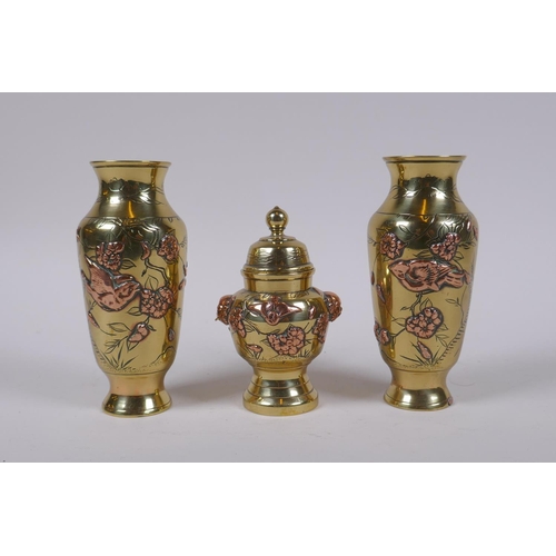 140 - A pair of Japanese brass spill vases with copper inlaid bird and prunus blossom decoration, and a ma... 