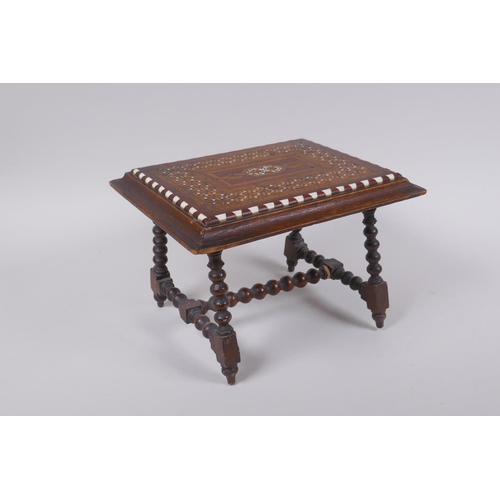 14 - An antique mahogany stand in the form of a table, with sadeli inlaid decoration to top and turned su... 