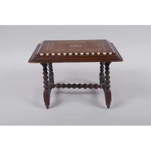 14 - An antique mahogany stand in the form of a table, with sadeli inlaid decoration to top and turned su... 