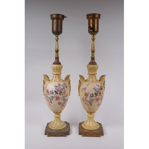 144 - A pair of continental porcelain urn shaped table lamps with gilt metal mounts and polychrome floral ... 