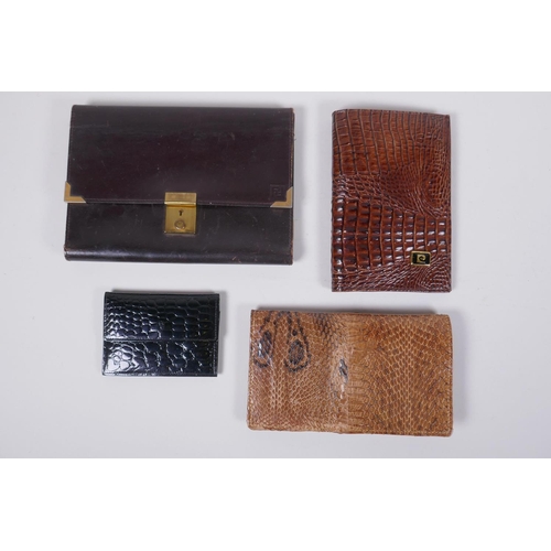 152 - An Italian Fendi leather document wallet, a snake skin wallet and two imitation animal skin purses, ... 