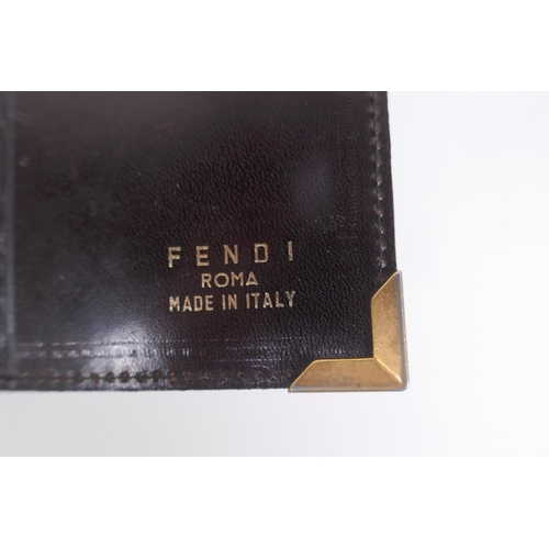 152 - An Italian Fendi leather document wallet, a snake skin wallet and two imitation animal skin purses, ... 