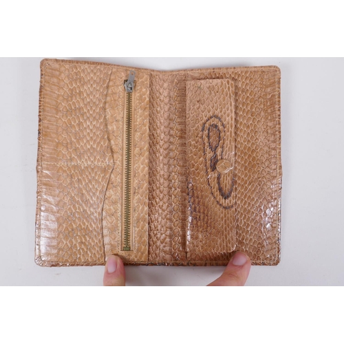 152 - An Italian Fendi leather document wallet, a snake skin wallet and two imitation animal skin purses, ... 