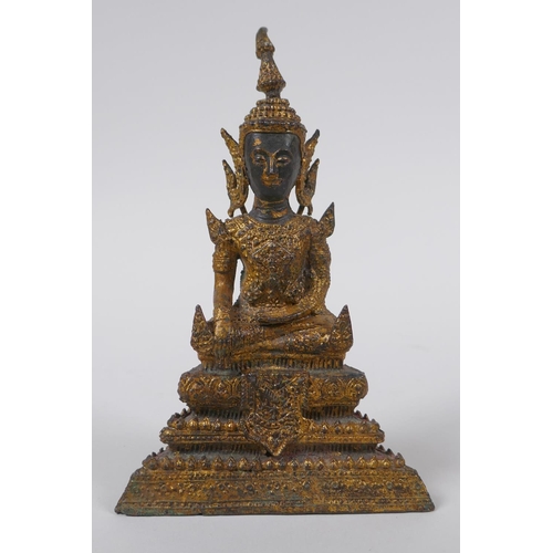 155 - A Thai gilt bronze figure of Buddha, 16cm high