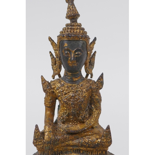 155 - A Thai gilt bronze figure of Buddha, 16cm high