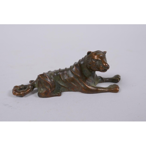 156 - A Japanese bronze okimono tiger, mark to base, 9cm long