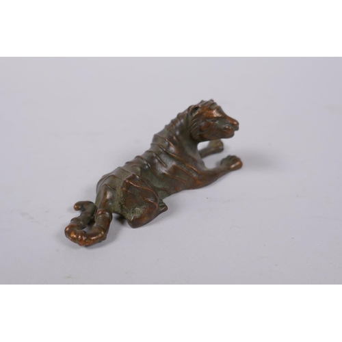 156 - A Japanese bronze okimono tiger, mark to base, 9cm long