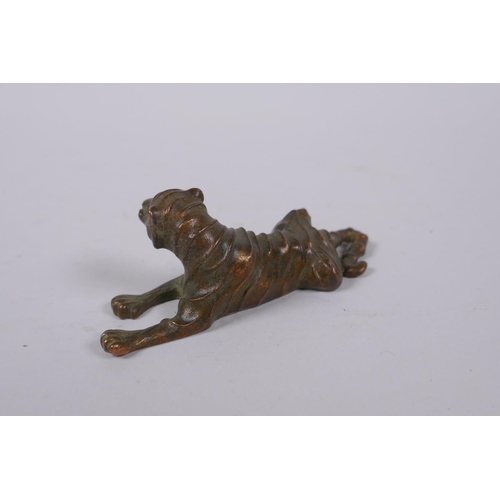 156 - A Japanese bronze okimono tiger, mark to base, 9cm long