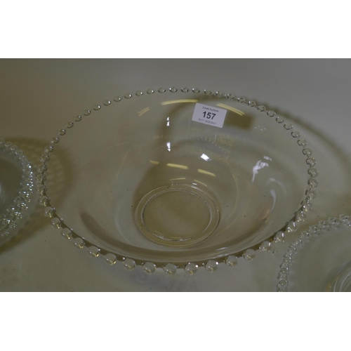 157 - A late C19th/early C20th glass dessert service comprising a bowl and 13 dishes, bowl 25cm diameter, ... 