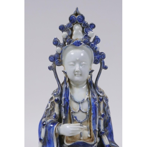 158 - A Chinese blue and white porcelain figure of Quan Yin, 29cm high