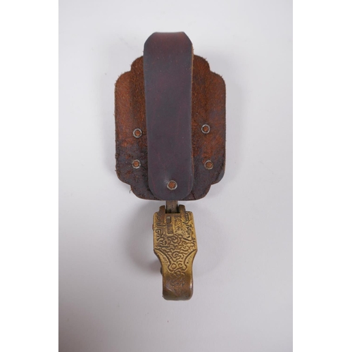 163 - A Chinese leather and bronze buckle with tiger and carp decoration, inscription verso, 13cm