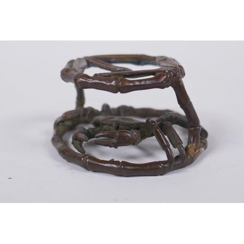 166 - An oriental bronze bamboo style stand with a crab, 6cm diameter