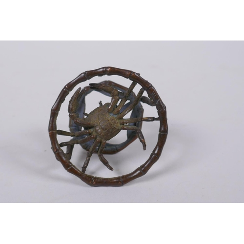 166 - An oriental bronze bamboo style stand with a crab, 6cm diameter