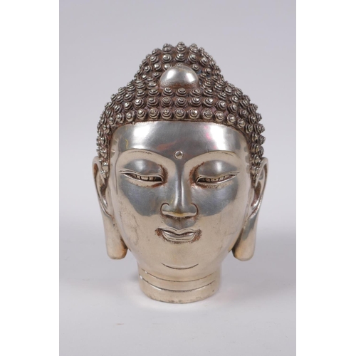 173 - A Sino Tibetan filled white metal Buddha head, impressed 4 character mark to base, 16cm high